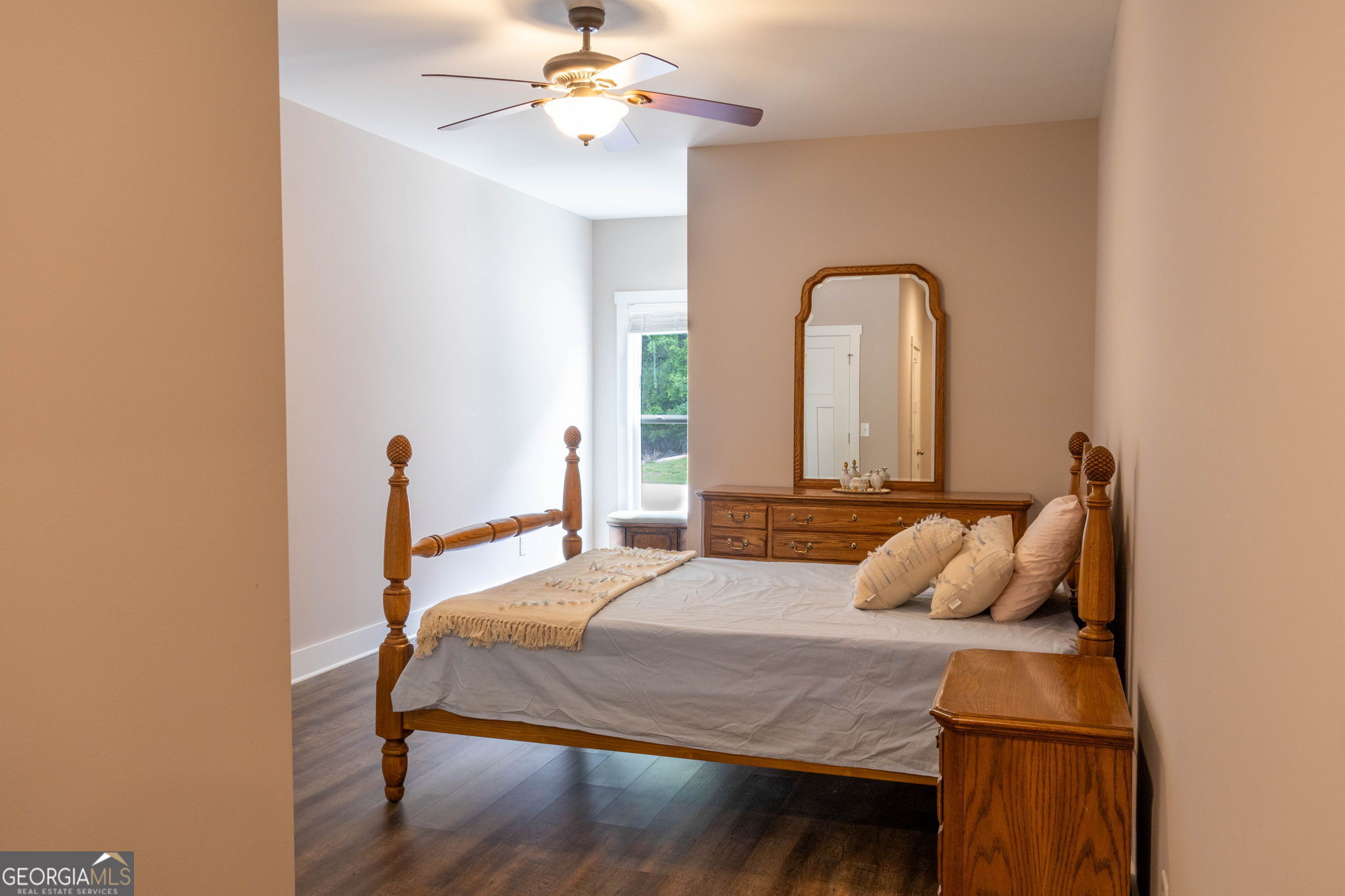 212 Old Clarkesville Mill Road, Unit C Clarkesville, GA 30523 - Photo 34 of 55 a bedroom with a bed and a chandelier