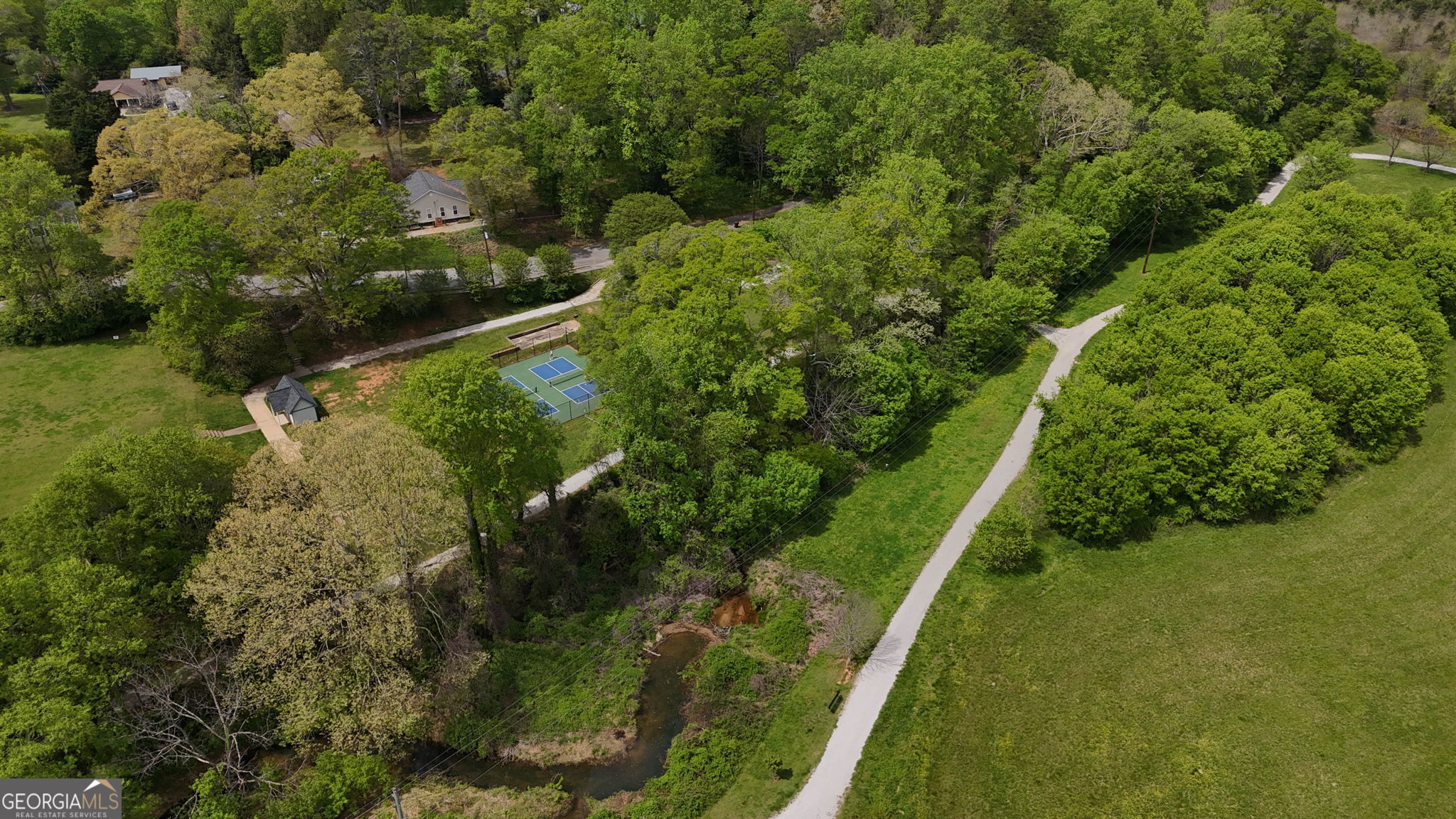 212 Old Clarkesville Mill Road, Unit C Clarkesville, GA 30523 - Photo 50 of 55 a view of a yard with plants and large trees