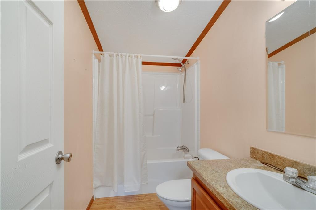 1064 Leesburg Station Road Mercer, PA 16137 - Photo 17 of 25 a bathroom with a sink toilet and shower
