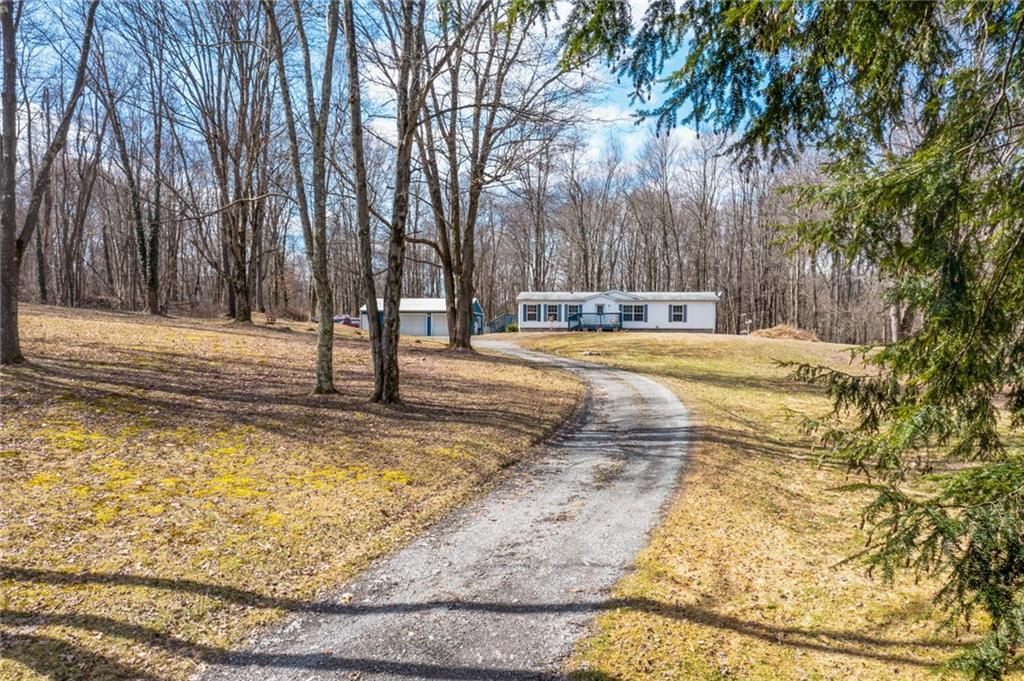 1064 Leesburg Station Road Mercer, PA 16137 - Photo 21 of 25 a view of a yard with trees
