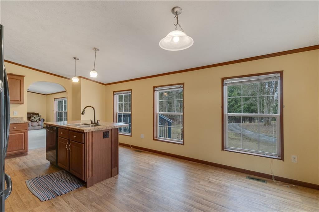 1064 Leesburg Station Road Mercer, PA 16137 - Photo 6 of 25 a open kitchen with wooden cabinets and stainless steel appliances