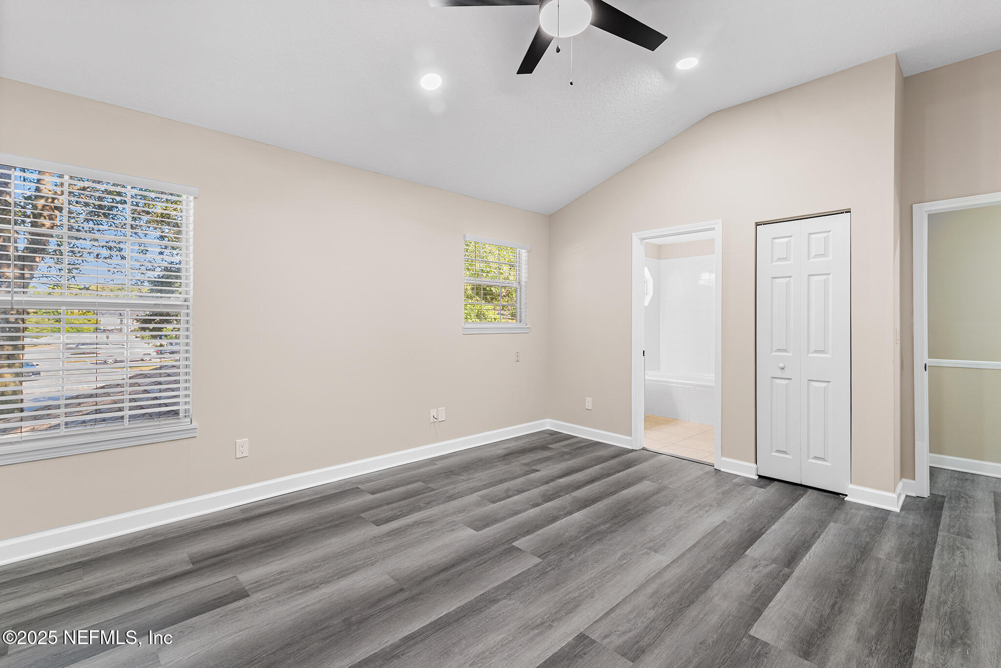 452 Dutton Island Road West Atlantic Beach, FL 32233 - Photo 18 of 25 wooden floor in an empty room with a window