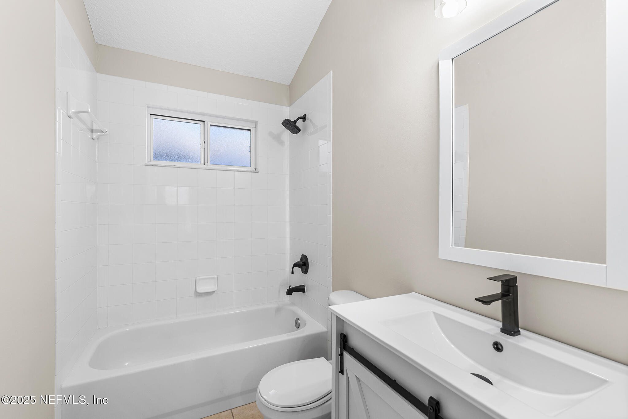 452 Dutton Island Road West Atlantic Beach, FL 32233 - Photo 20 of 25 a bathroom with a sink toilet and bathtub