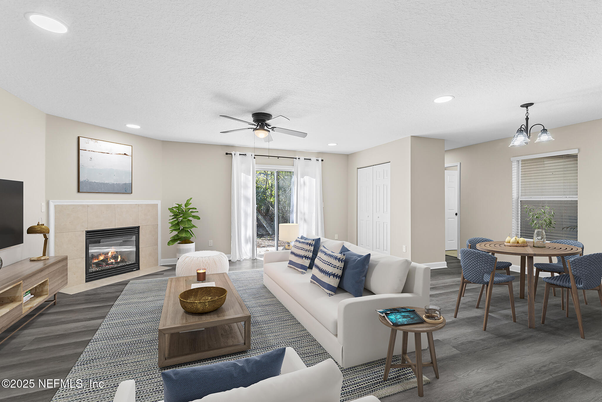 452 Dutton Island Road West Atlantic Beach, FL 32233 - Photo 3 of 25 a living room with furniture and a fireplace