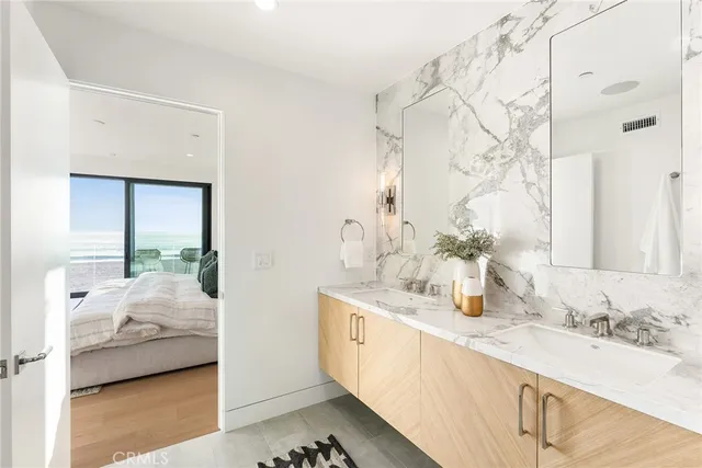 a room with a walk in closet and wooden floor
