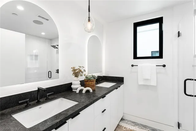 a bedroom with a bed and a wooden floor