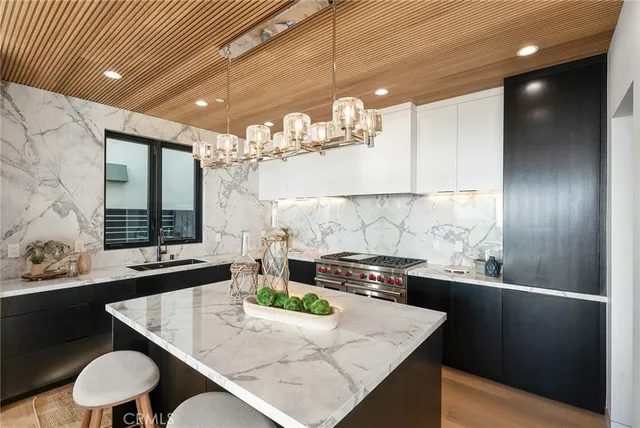 a kitchen with a sink and a refrigerator