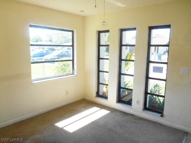 7441-43 Garry Road Fort Myers, FL 33967 - Photo 3 of 15 a view of an empty room with a window