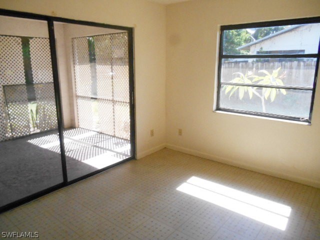 7441-43 Garry Road Fort Myers, FL 33967 - Photo 4 of 15 a view of an empty room with a window
