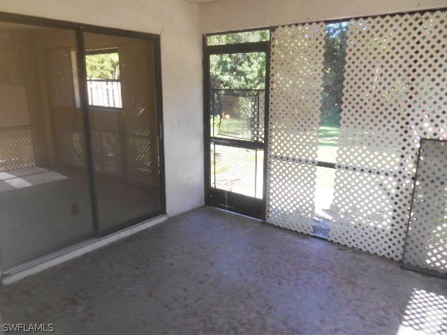 7441-43 Garry Road Fort Myers, FL 33967 - Photo 7 of 15 an empty room with windows