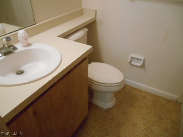 7441-43 Garry Road Fort Myers, FL 33967 - Photo 10 of 15 a bathroom with a sink and a toilet