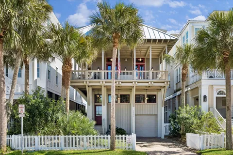 a front view of a building with a garden