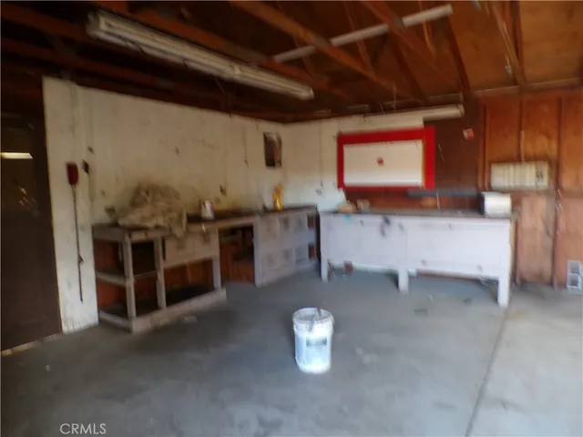 a view of a house with a yard covered in snow