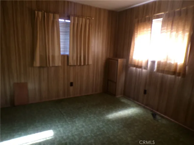 a view of empty room with windows