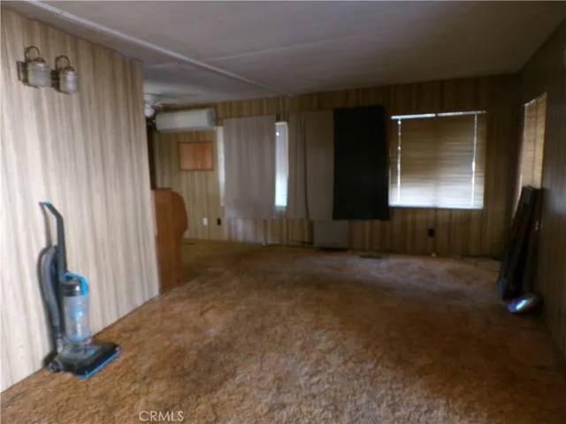 a view of livingroom with furniture and a flat screen tv