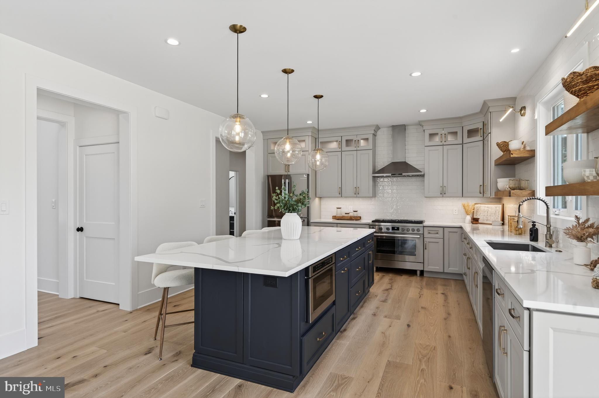 13 Rhoads Lane Media, PA 19063 - Photo 21 of 67 a large kitchen with stainless steel appliances kitchen island a large island in the center