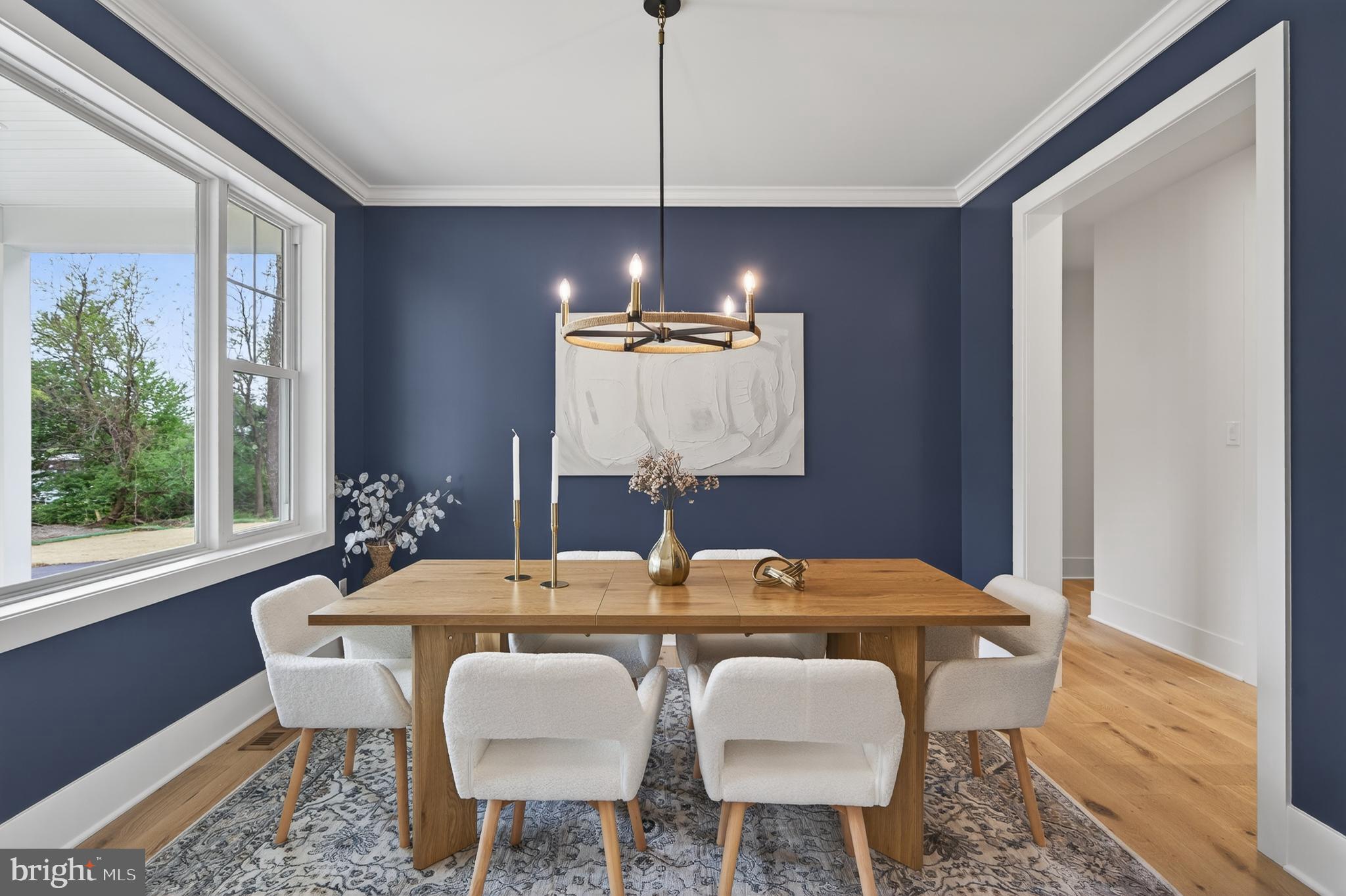 13 Rhoads Lane Media, PA 19063 - Photo 31 of 67 a dining room with furniture a chandelier and wooden floor