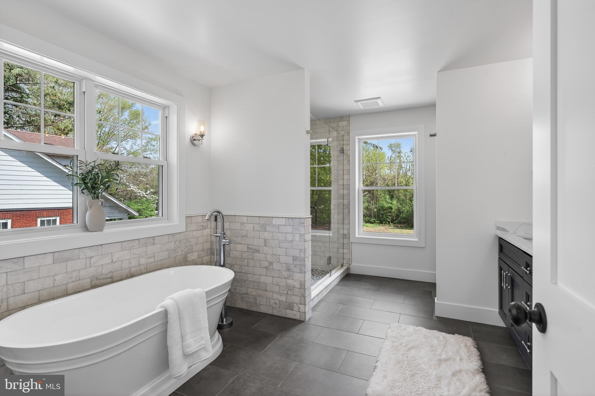 13 Rhoads Lane Media, PA 19063 - Photo 43 of 67 a bathroom with a bathtub and window