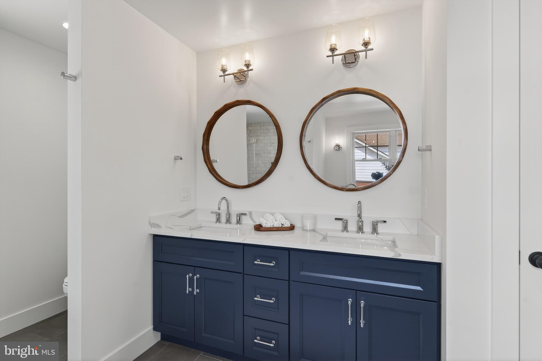 13 Rhoads Lane Media, PA 19063 - Photo 47 of 67 a bathroom with a sink and a mirror