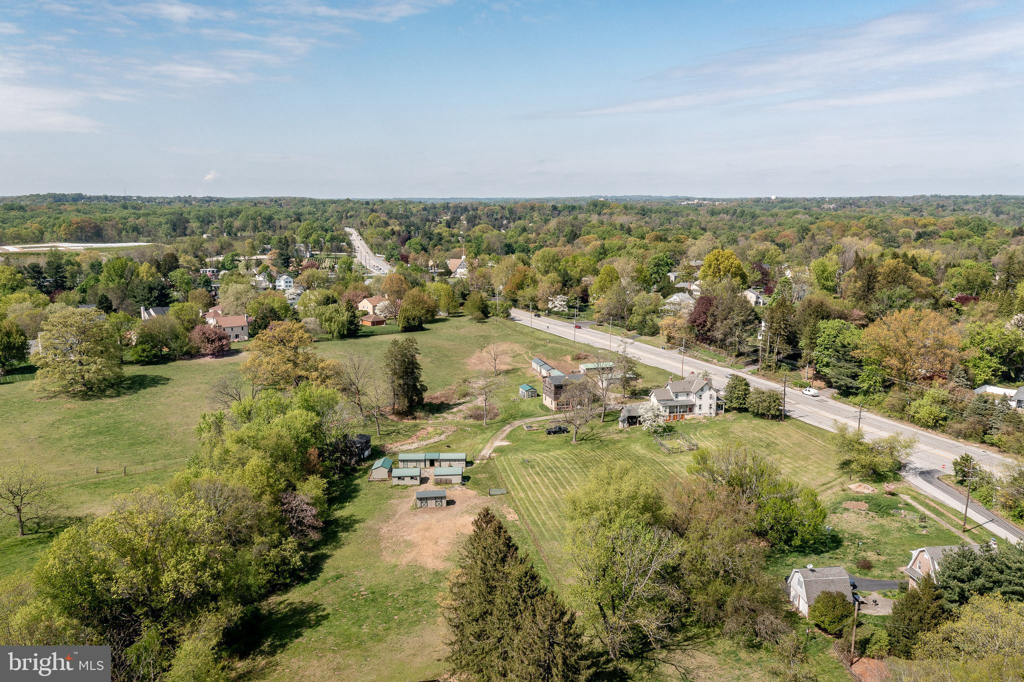 13 Rhoads Lane Media, PA 19063 - Photo 60 of 67 an aerial view of residential building and lake