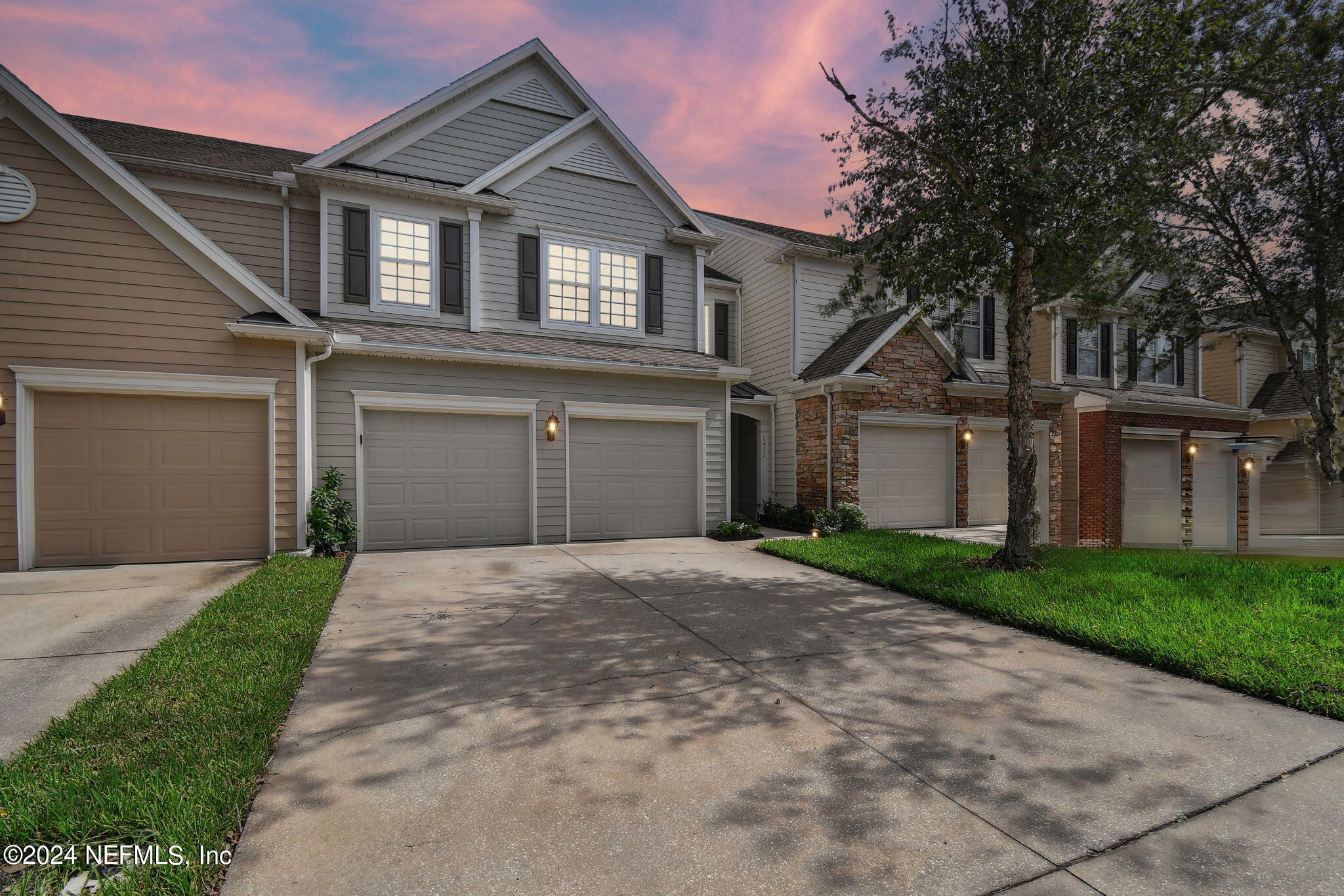 7473 Devondale Way Jacksonville, FL 32256 - Photo 1 of 68 a front view of a house with a yard and garage