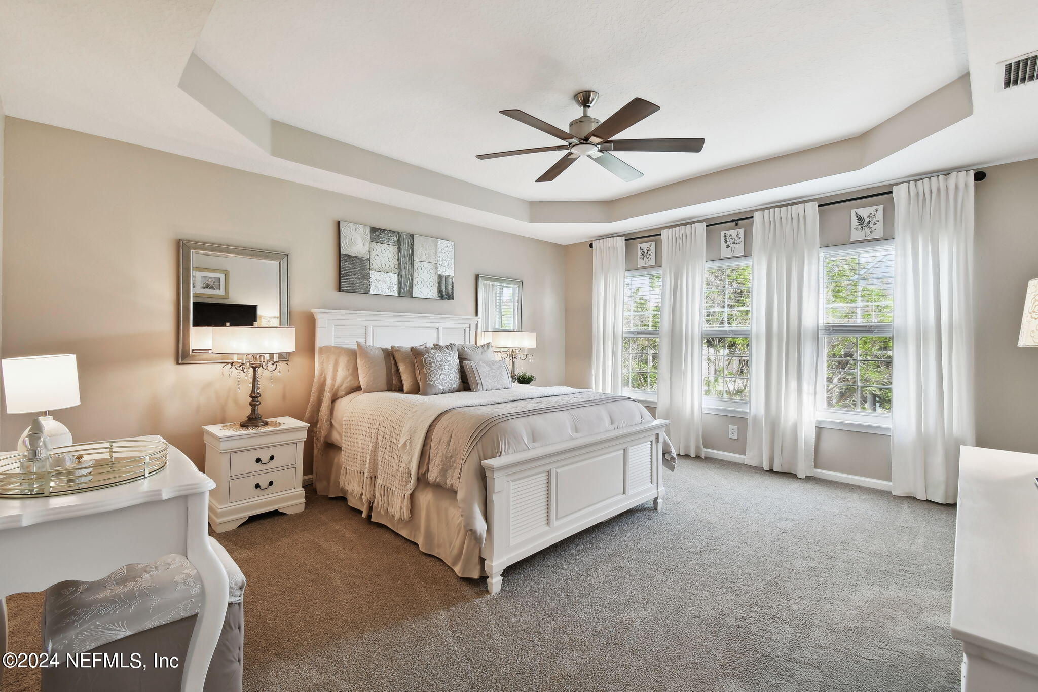 7473 Devondale Way Jacksonville, FL 32256 - Photo 32 of 68 a spacious bedroom with a bed and window