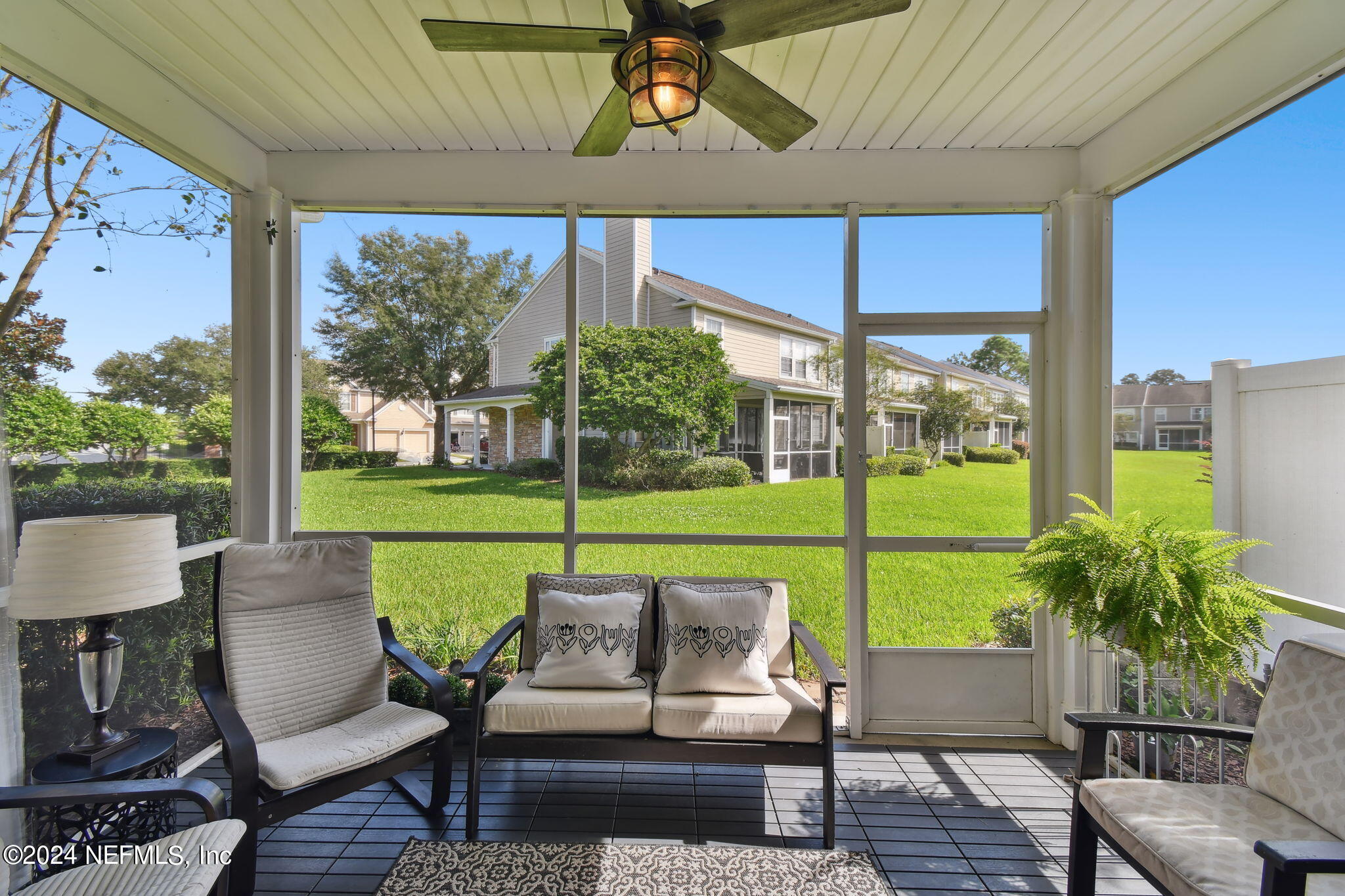 7473 Devondale Way Jacksonville, FL 32256 - Photo 43 of 68 a outdoor living space with furniture and garden view