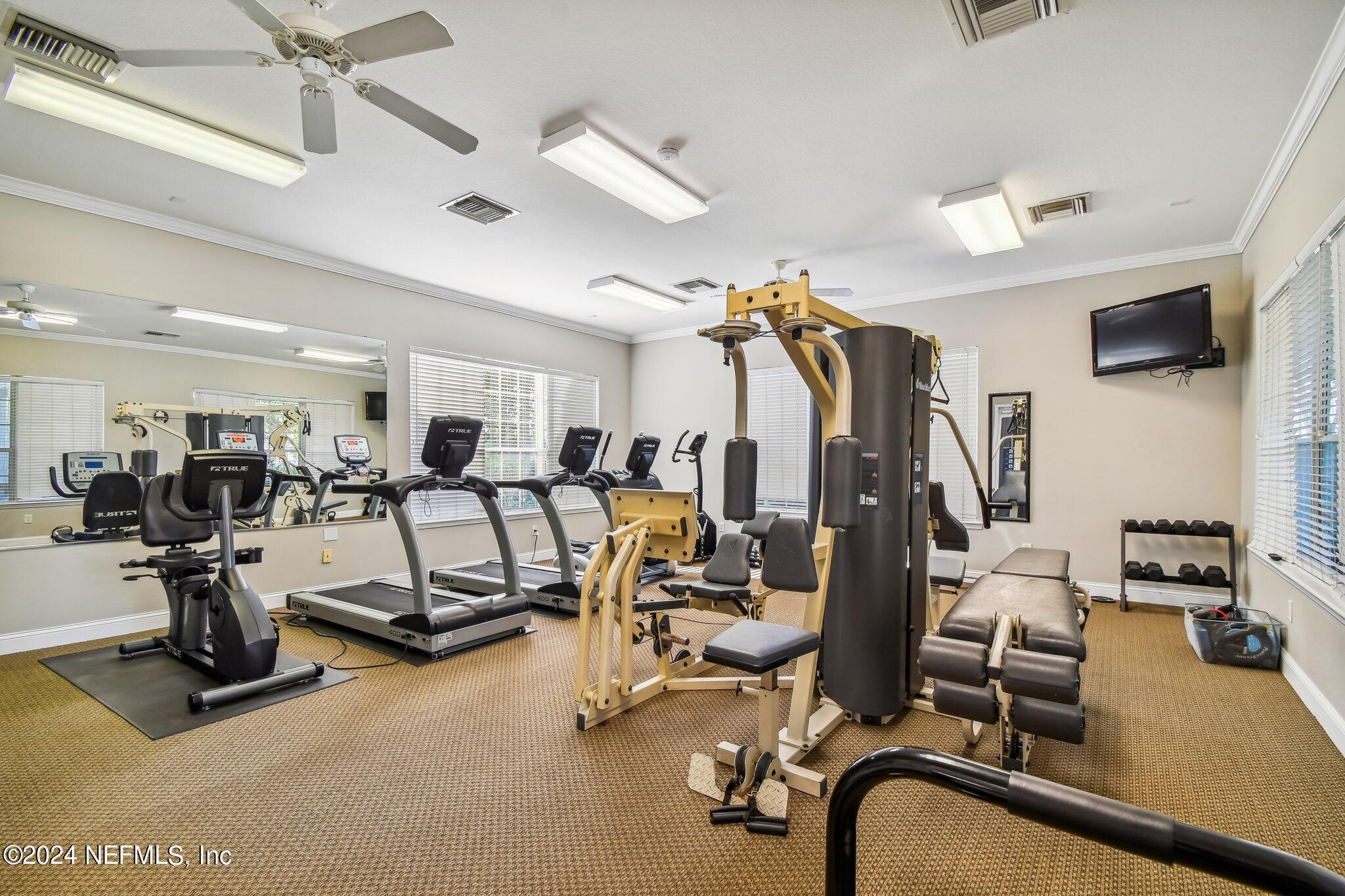 7473 Devondale Way Jacksonville, FL 32256 - Photo 57 of 68 a view of a room with gym equipment