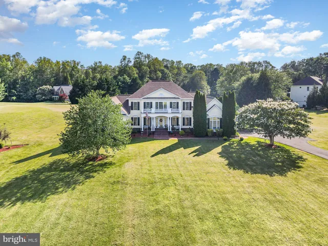 a swimming pool with trees in the background