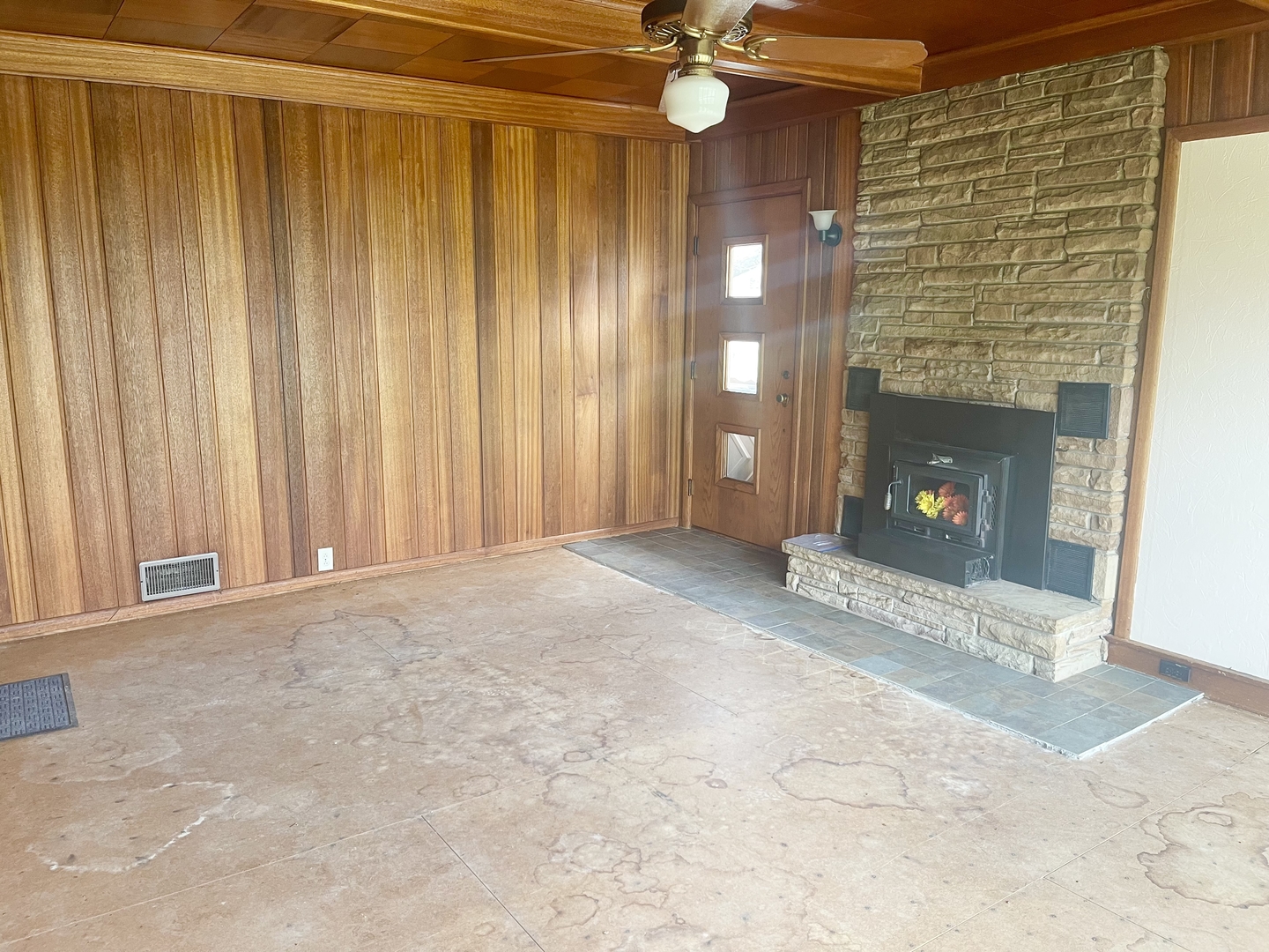 505 North St Paul Street Mark, IL 61326 - Photo 11 of 24 a view of an empty room with a fireplace and fan