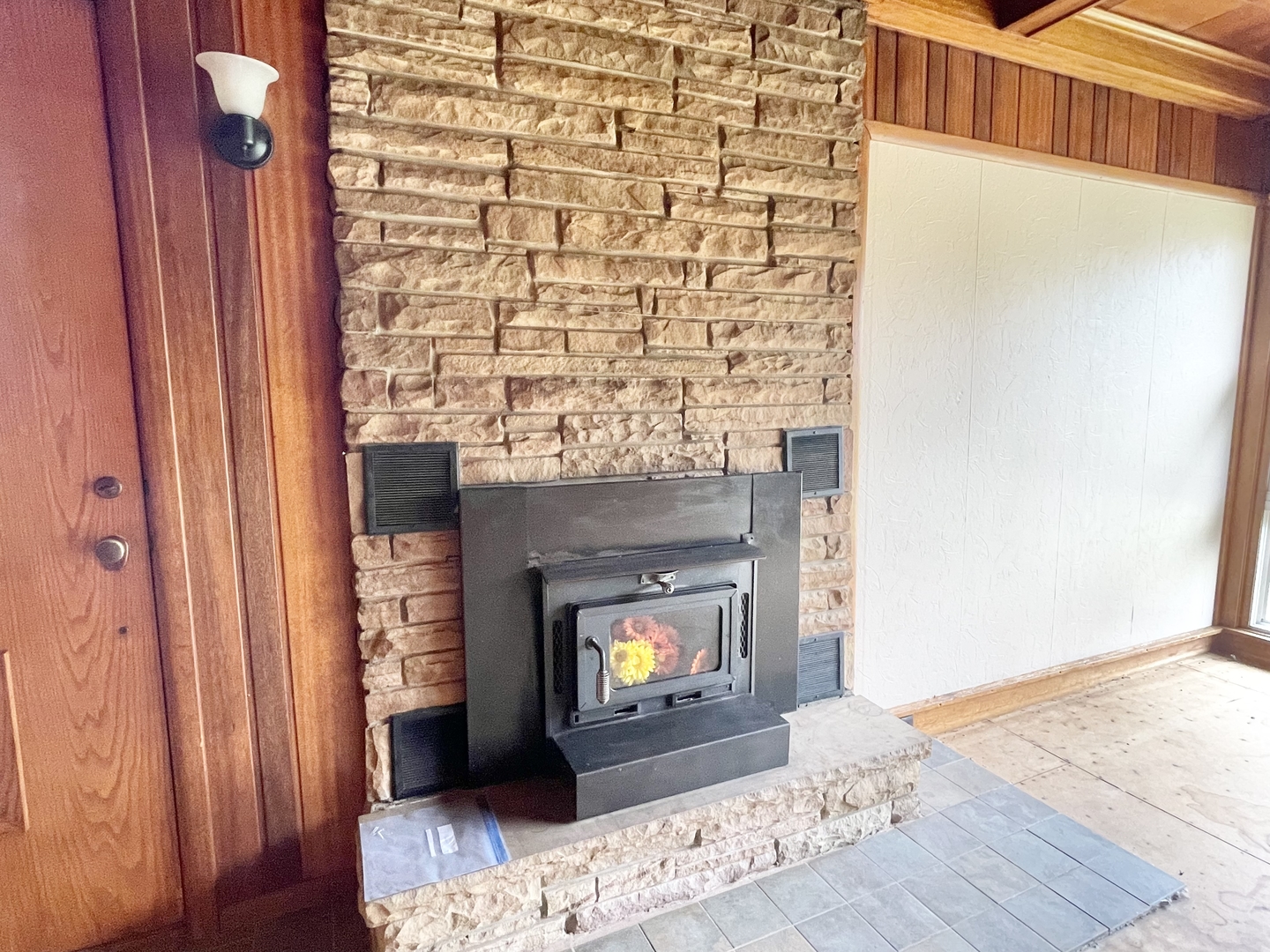 505 North St Paul Street Mark, IL 61326 - Photo 12 of 24 a room with a fireplace and wooden floor