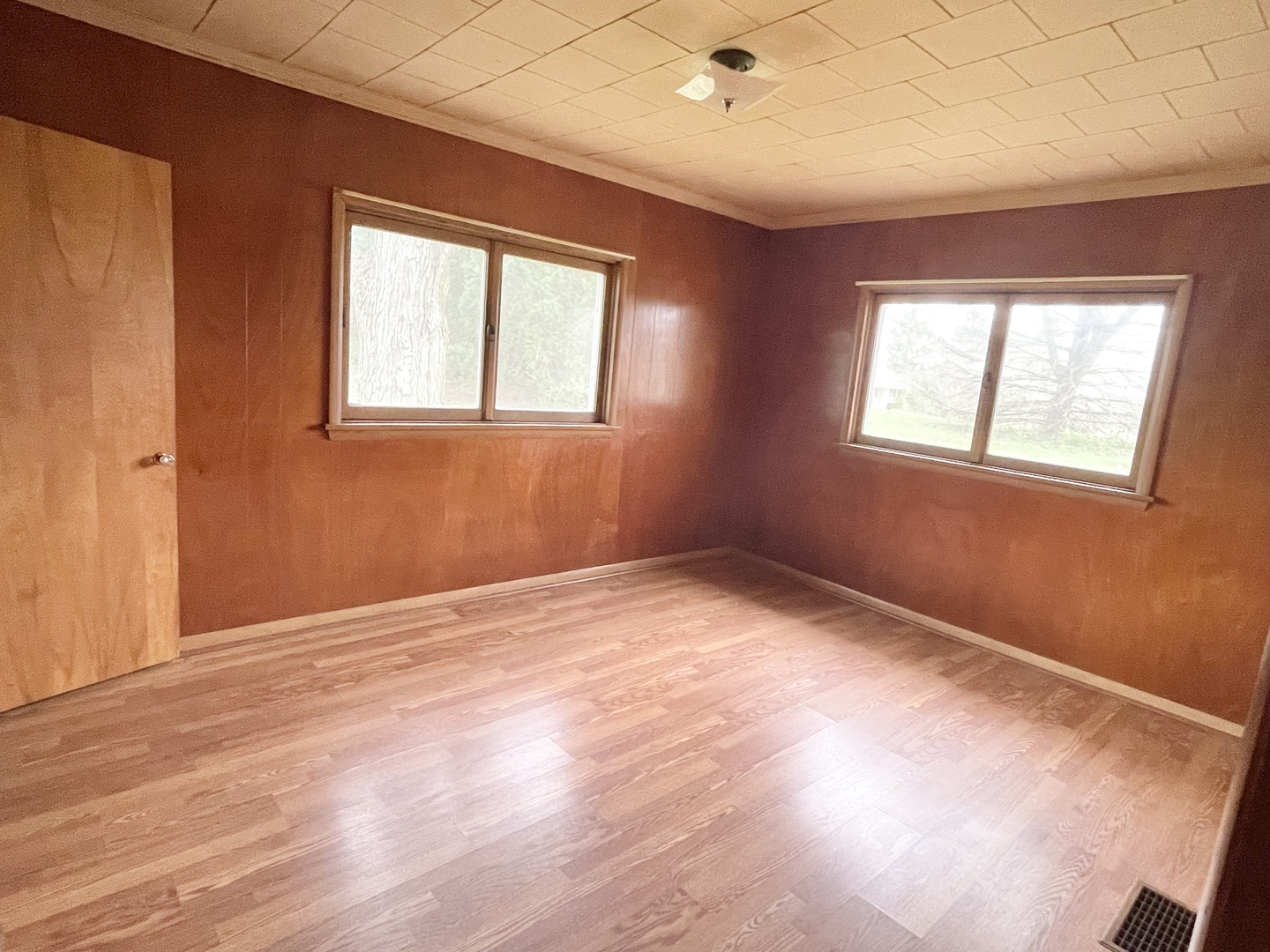 505 North St Paul Street Mark, IL 61326 - Photo 14 of 24 an empty room with wooden floor and windows