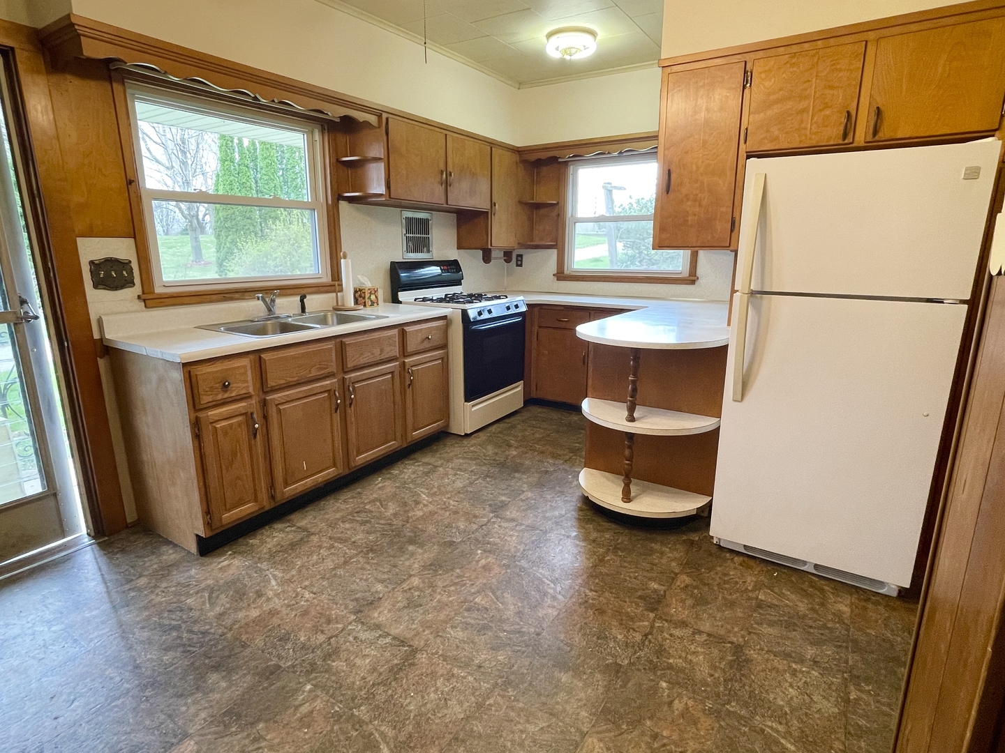 505 North St Paul Street Mark, IL 61326 - Photo 17 of 24 a kitchen with stainless steel appliances a refrigerator sink and white cabinets