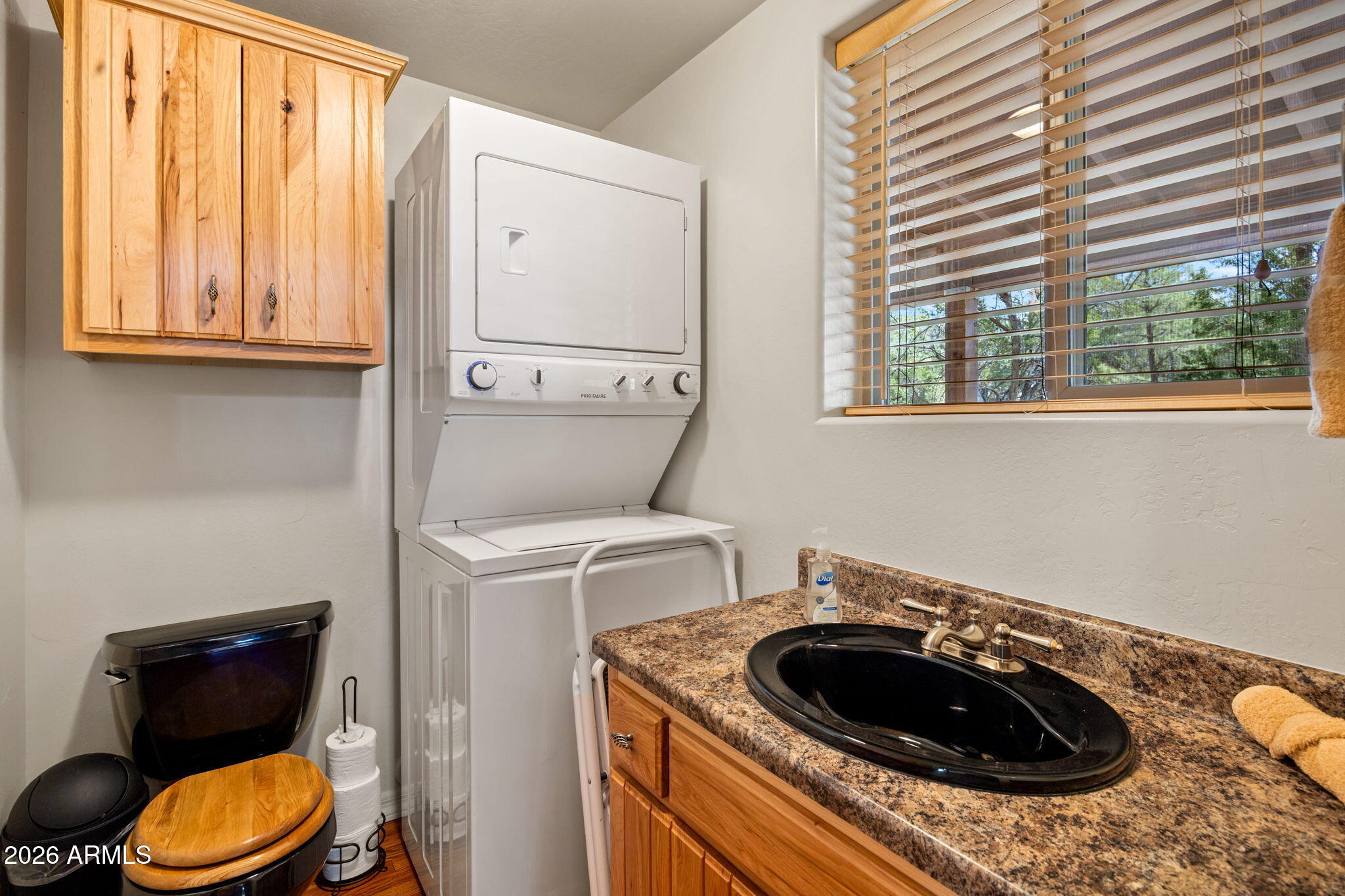 3166 Chevelon Road Overgaard, AZ 85933 - Photo 13 of 41 1/2 BATH WITH STACKABLE WASHER AND DRYER
