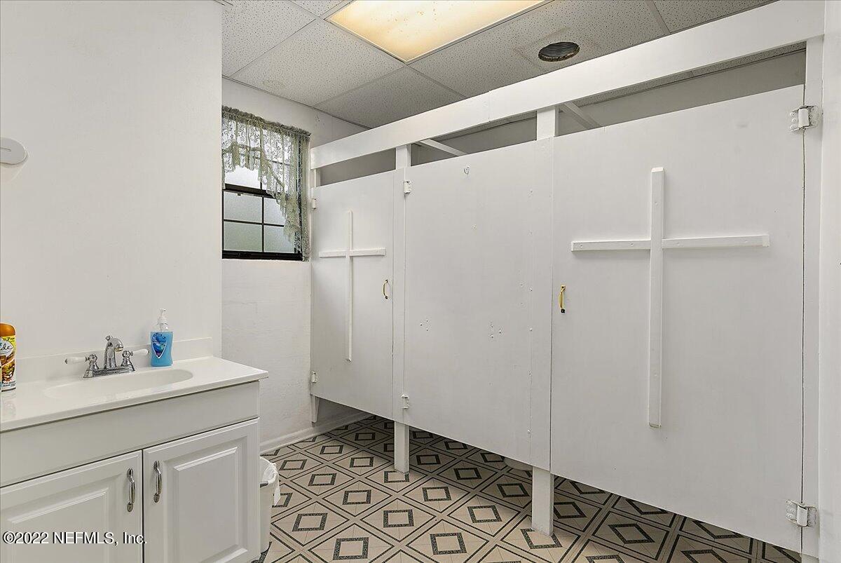 2701 Dean Road Jacksonville, FL 32216 - Photo 16 of 19 a bathroom with a sink and a mirror
