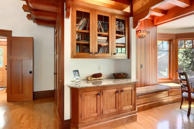 a view of balcony with a couch and wooden floor
