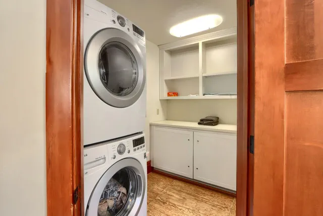a view of a hallway with washer and dryer