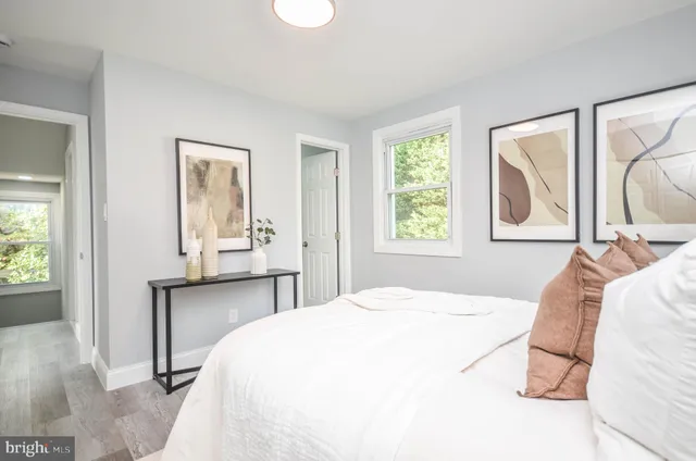 a bedroom with a bed and a table