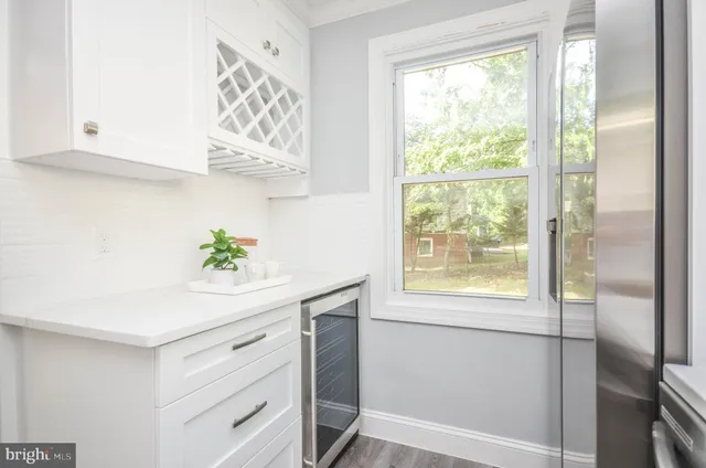 a view of an entryway with wooden floor