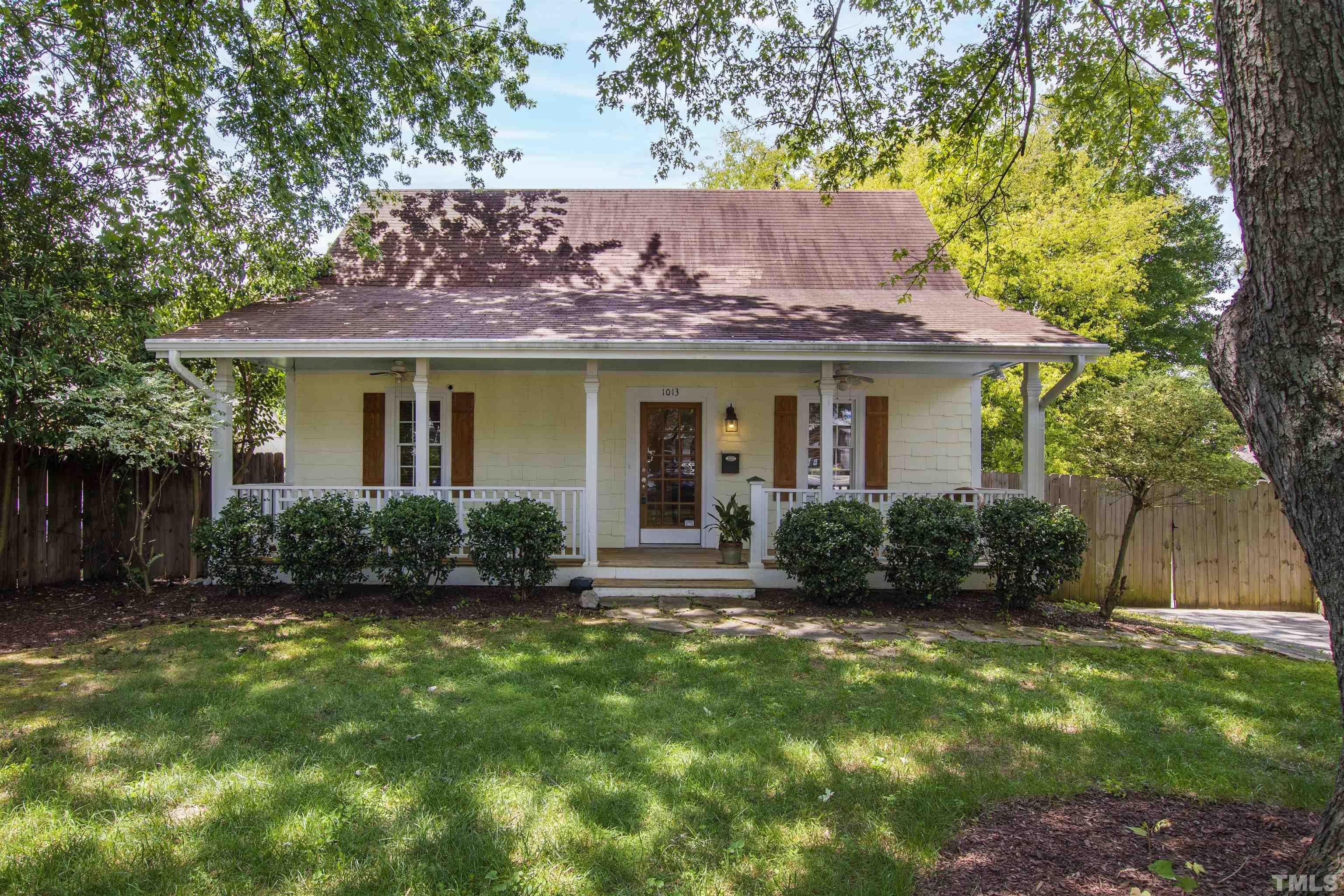 1013 Brookside Drive Raleigh, NC 27604 - Photo 1 of 40 a view of a house with a yard and potted plants