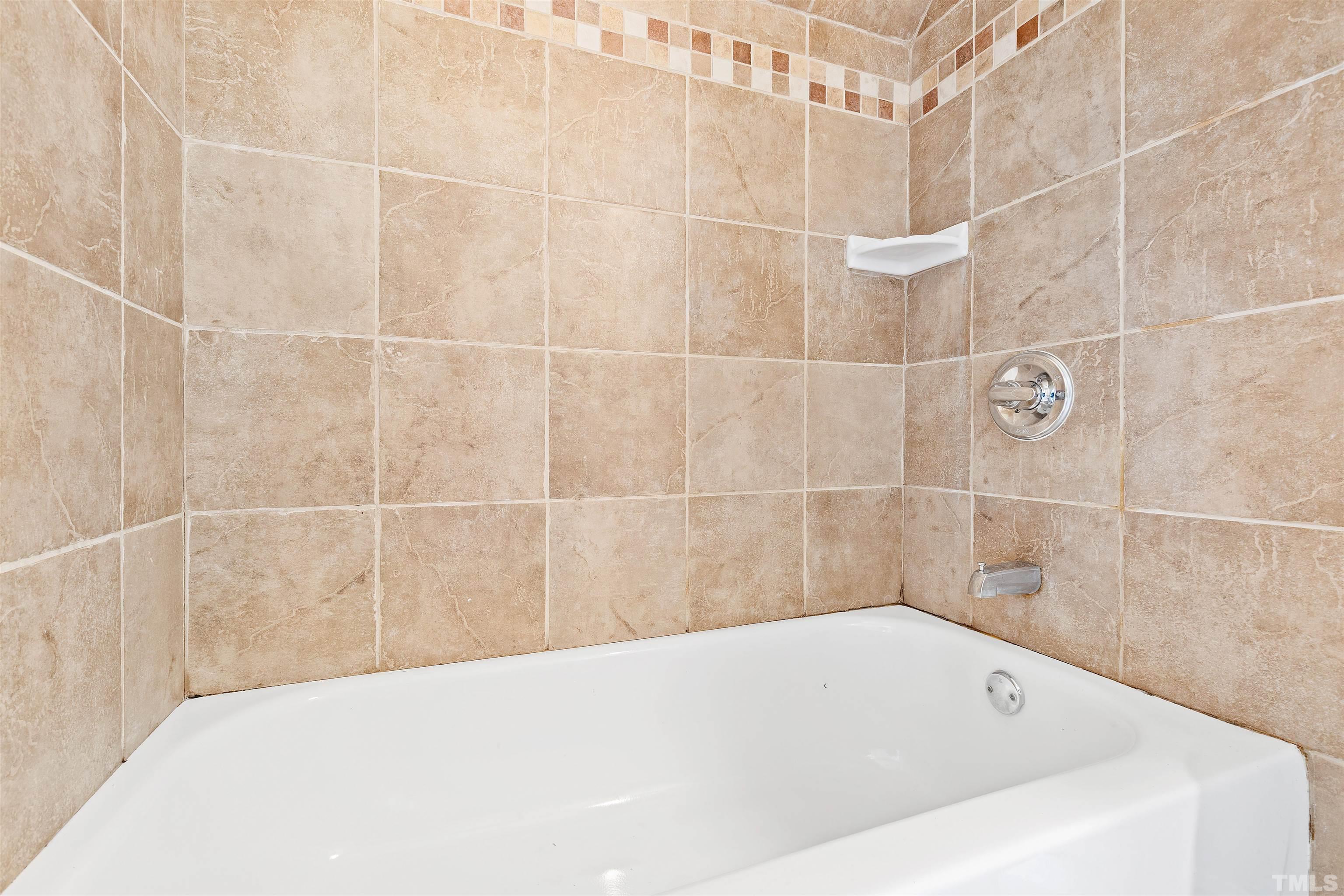 1013 Brookside Drive Raleigh, NC 27604 - Photo 26 of 40 a bathroom with a bathtub
