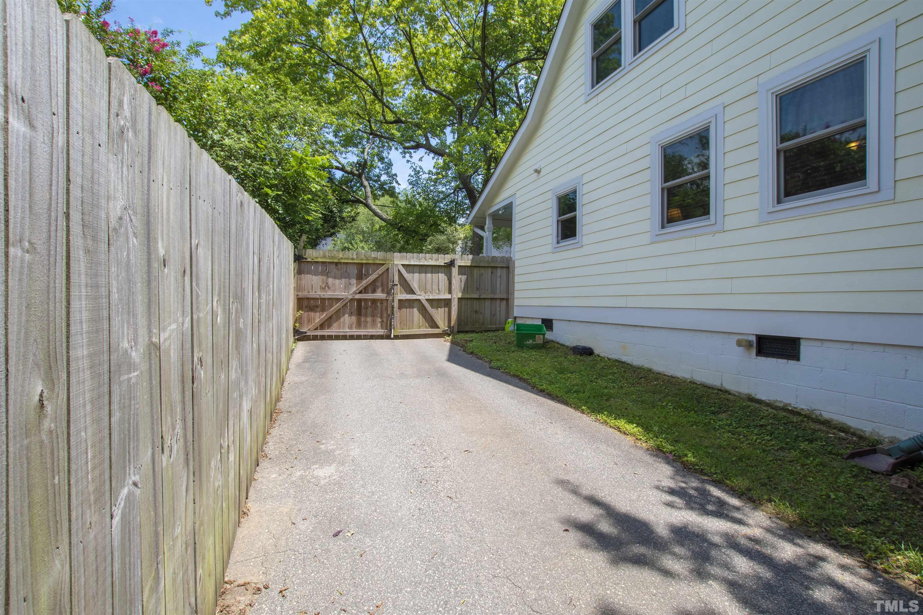 1013 Brookside Drive Raleigh, NC 27604 - Photo 33 of 40 a view of a backyard with a garden