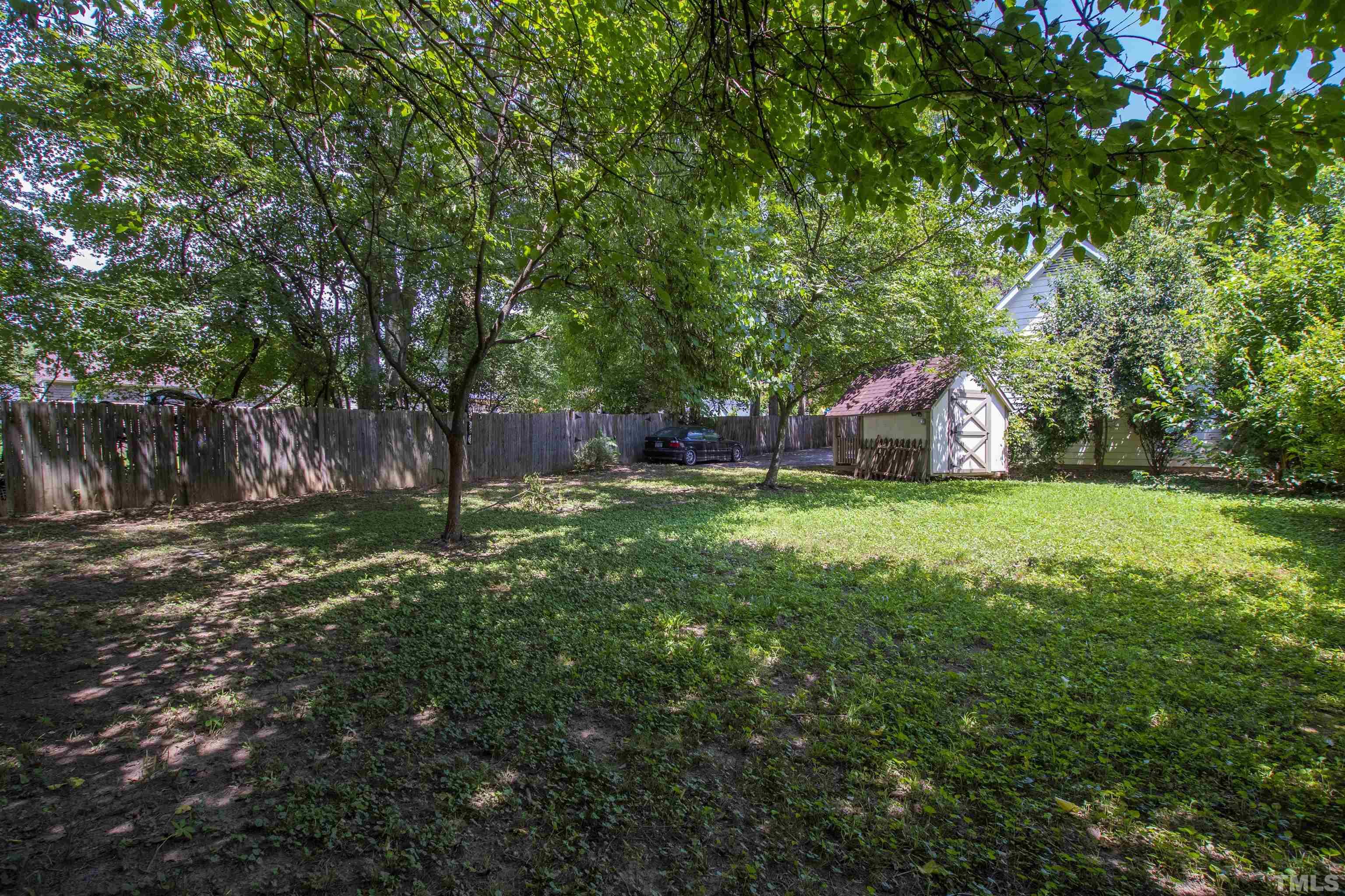 1013 Brookside Drive Raleigh, NC 27604 - Photo 36 of 40 a view of an house with backyard space and garden