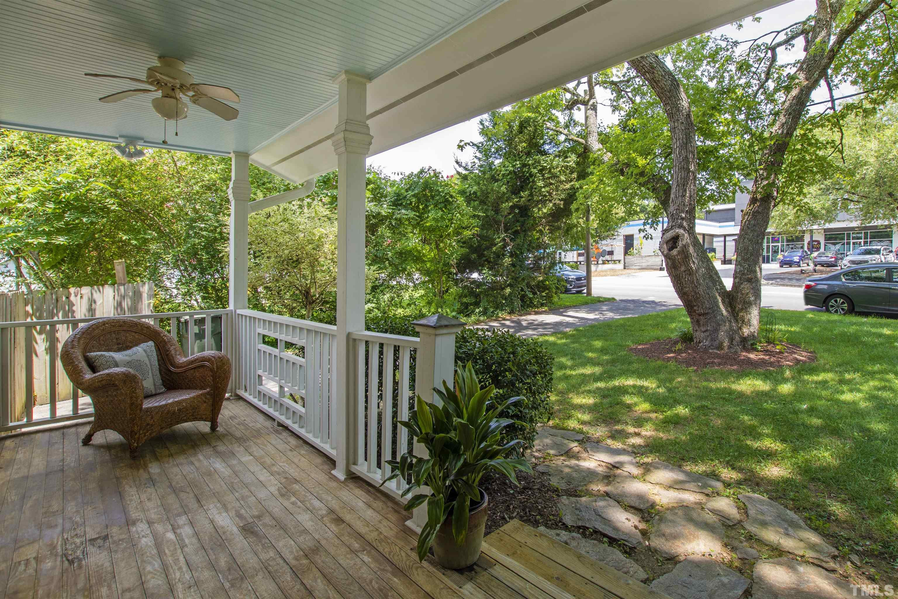 1013 Brookside Drive Raleigh, NC 27604 - Photo 4 of 40 a view of a porch with furniture and a yard