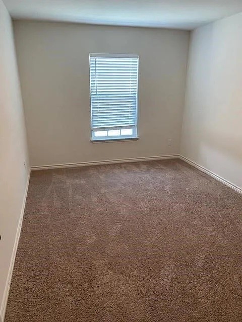 521 Locksley Cove Jarrell, TX 76537 - Photo 5 of 9 an empty room with a window