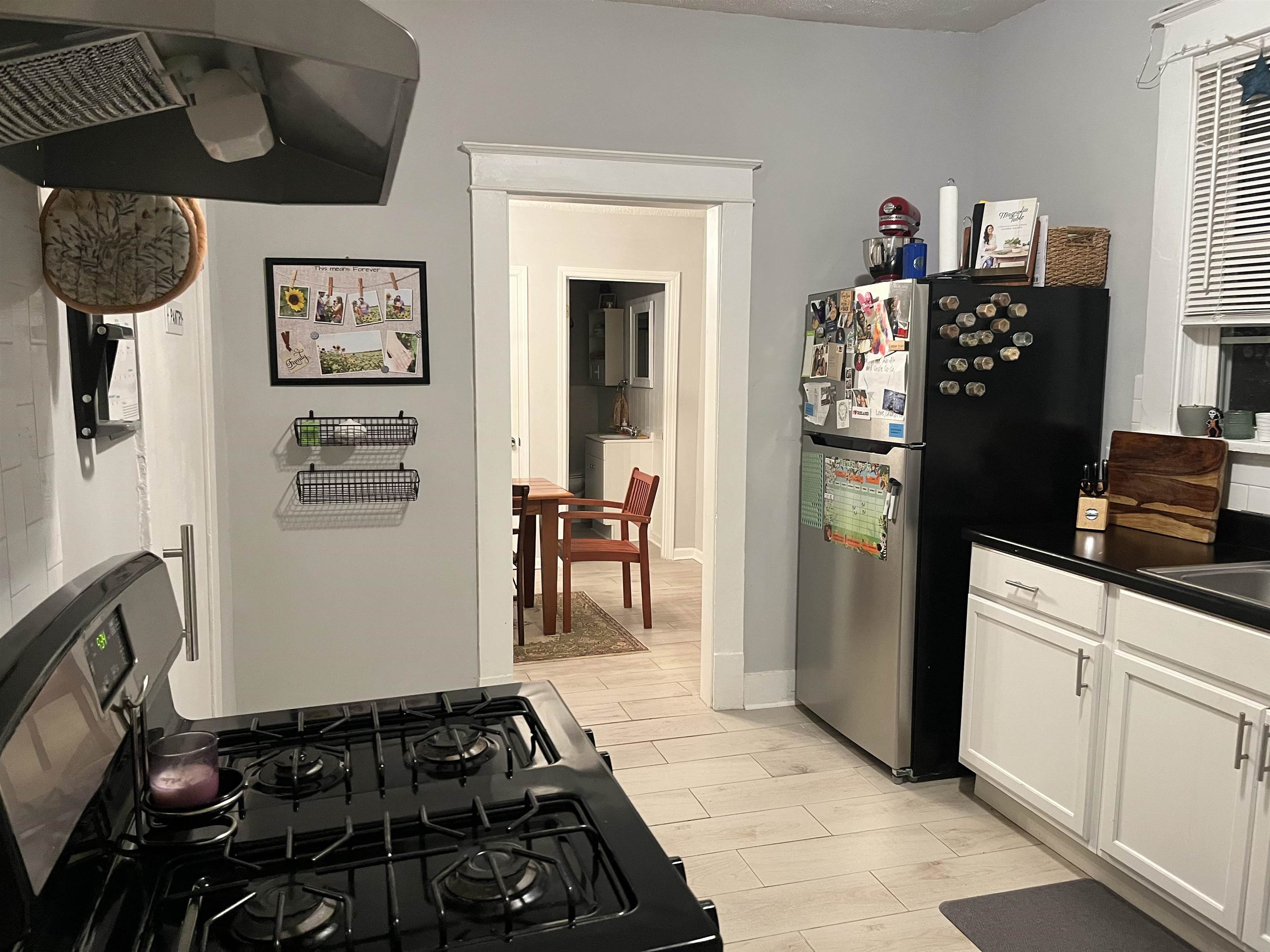 723 Spring Street Memphis, TN 38112 - Photo 12 of 18 a kitchen with a refrigerator and a stove