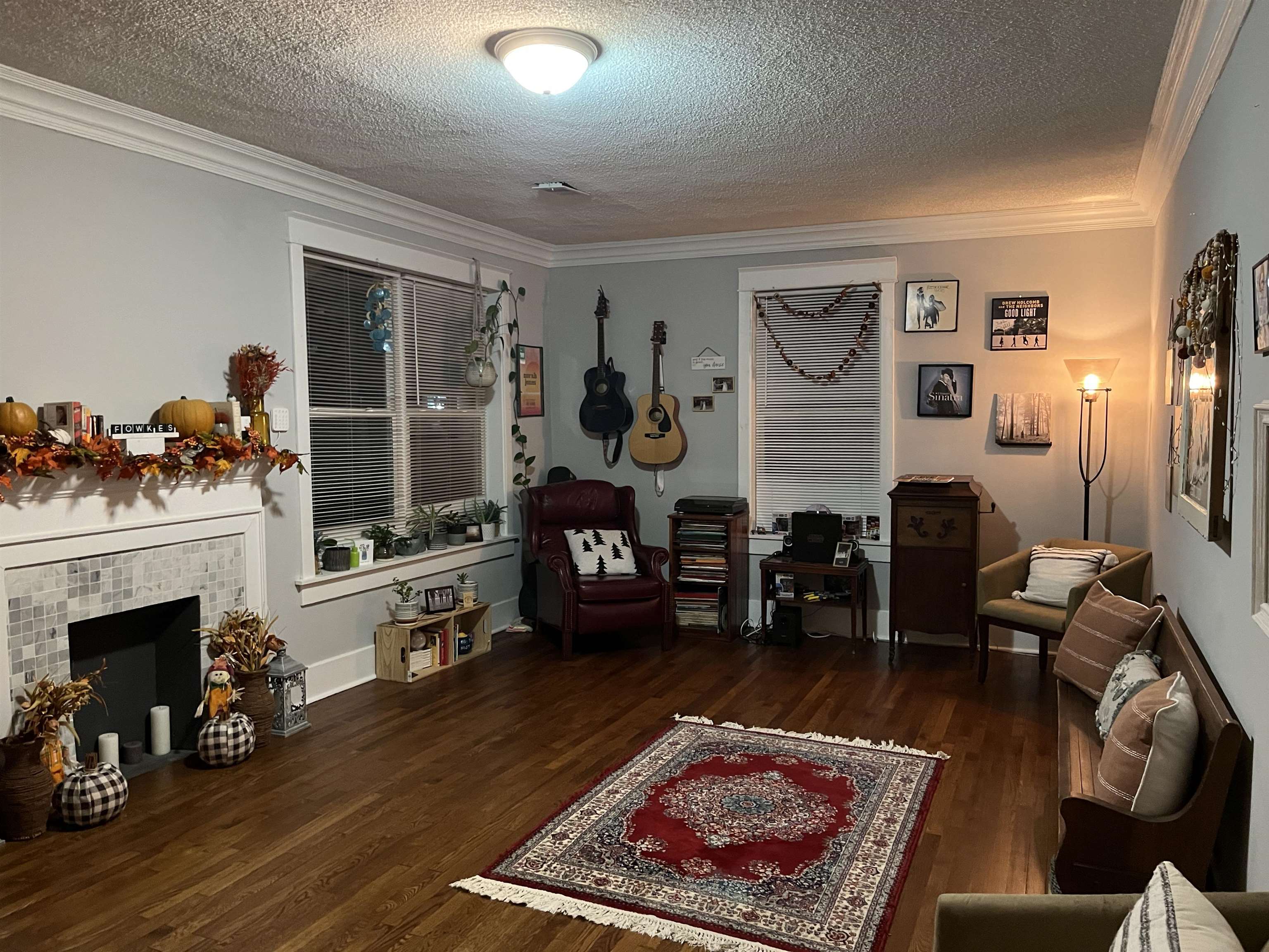 723 Spring Street Memphis, TN 38112 - Photo 14 of 18 a living room with furniture and a fireplace