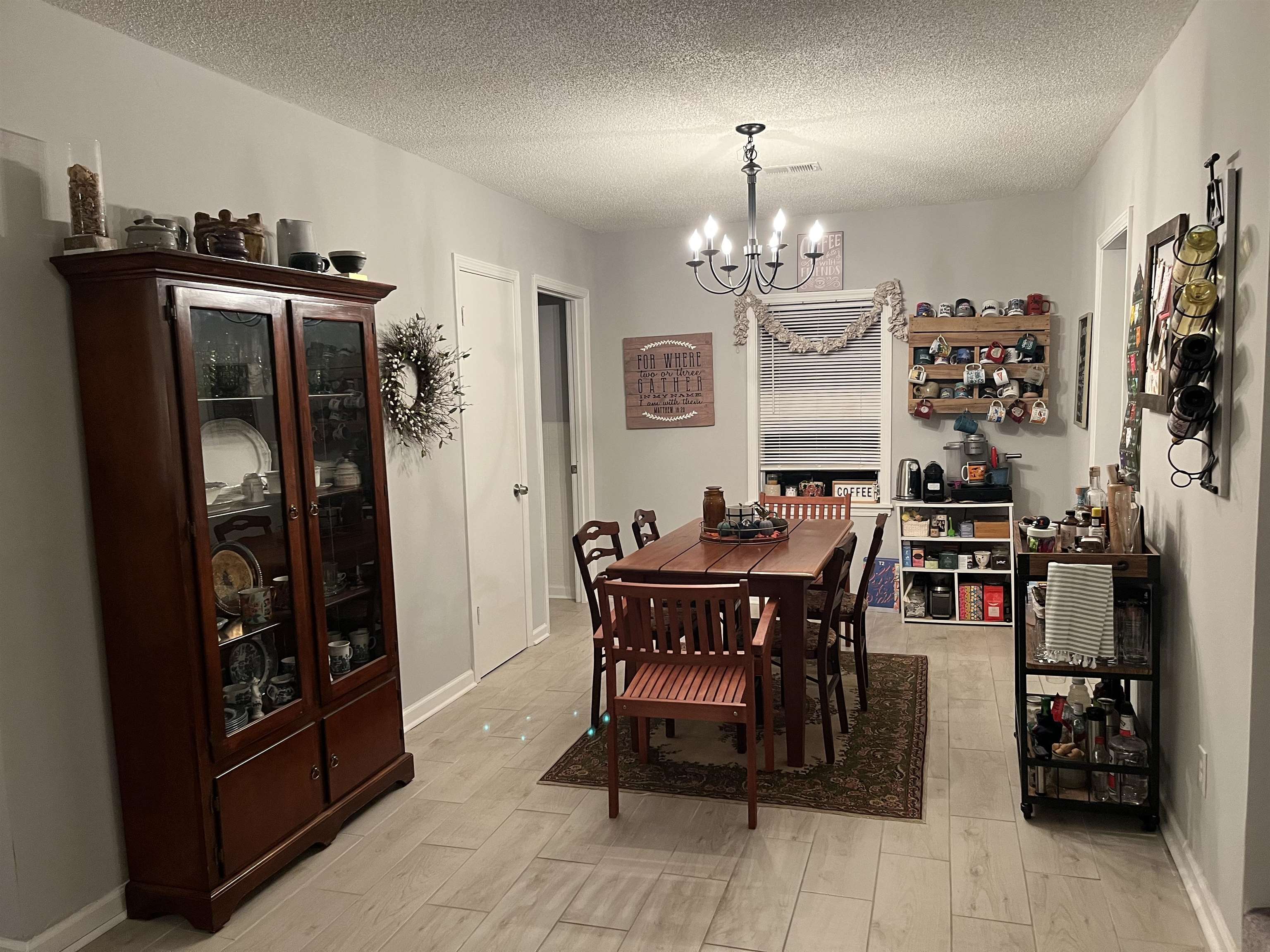 723 Spring Street Memphis, TN 38112 - Photo 6 of 18 a view of a dining room with furniture and chandelier