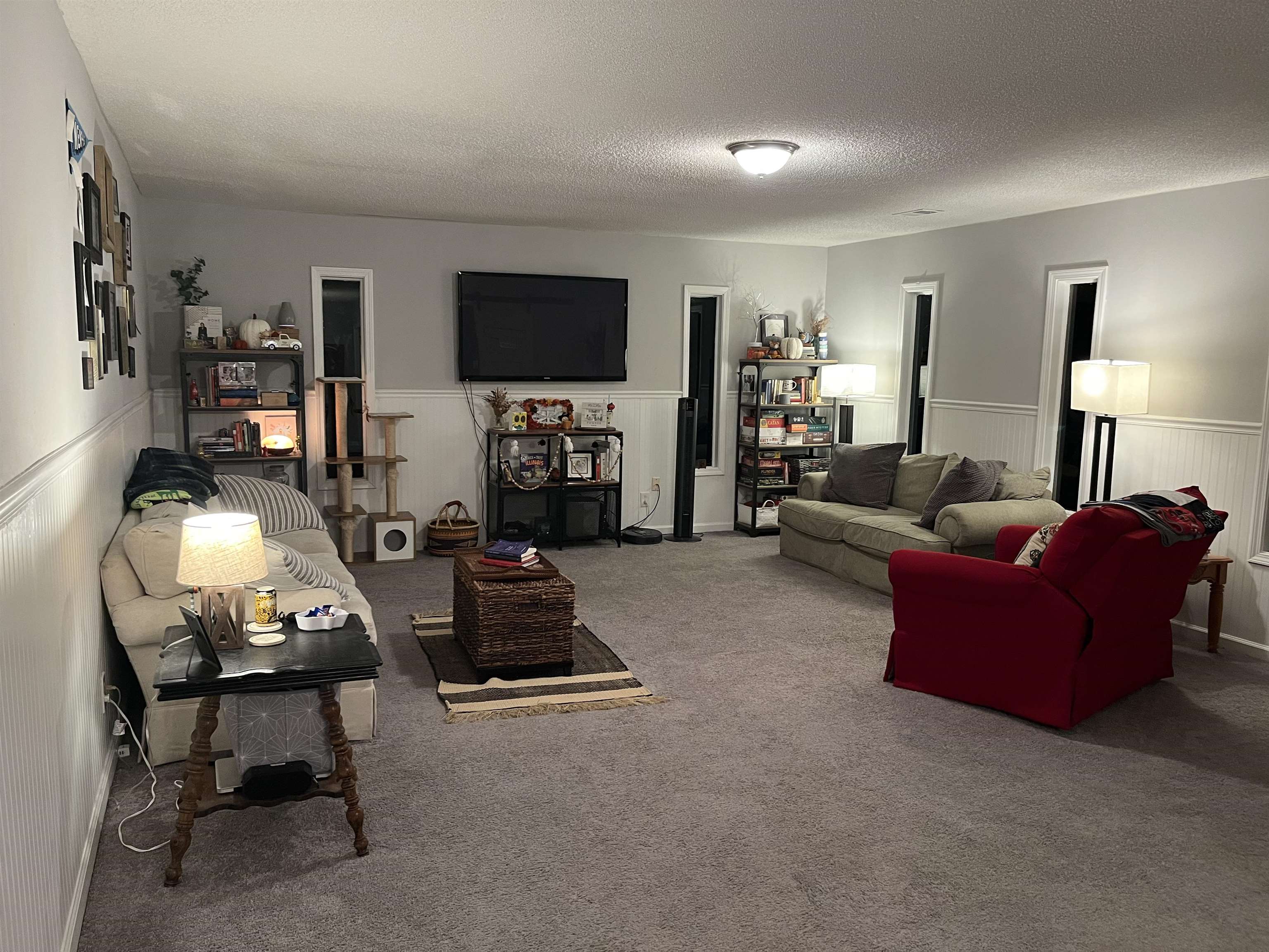 723 Spring Street Memphis, TN 38112 - Photo 8 of 18 a living room with furniture and a flat screen tv