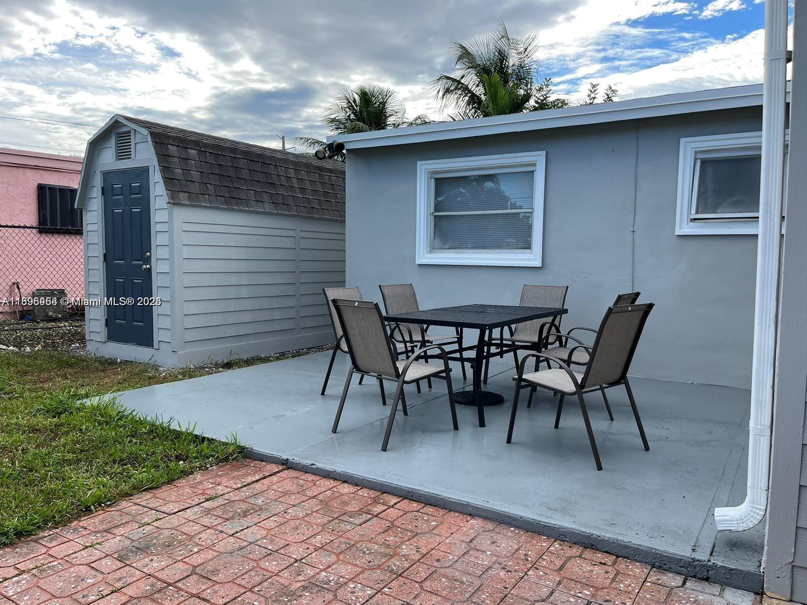 6431 Hayes Street, Unit 2 Hollywood, FL 33024 - Photo 14 of 14 a view of a house with a patio